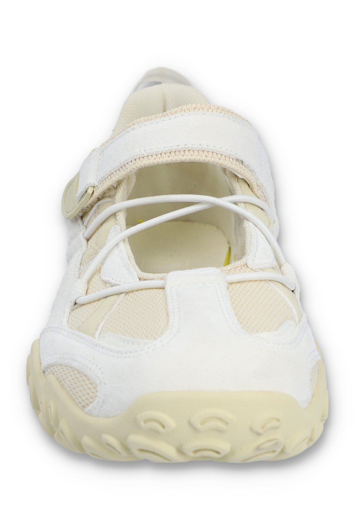 White sneaker with a light sole on a white background