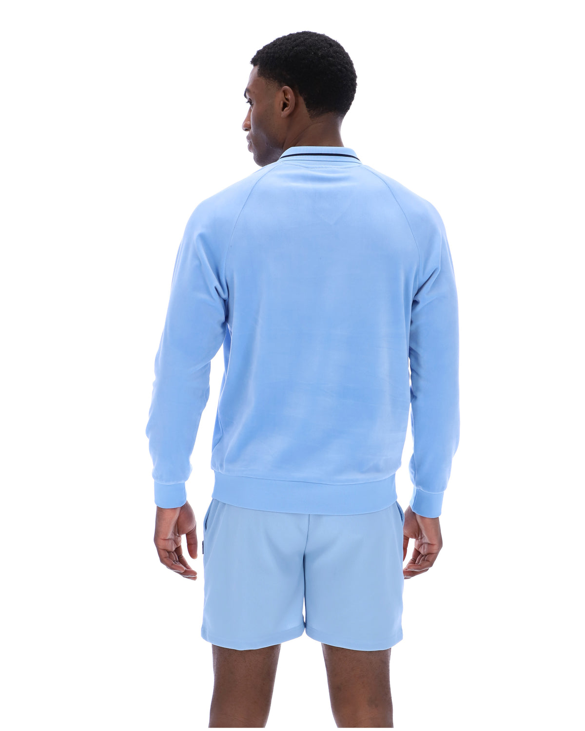 Displays a model wearing the Frozen 'FILA' branded Fjord Alfredo 1911 Velour Raglan Long-Sleeve Top