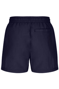 A person wearing black Artoni Swim Shorts with a drawstring waistband and the FILA logo on the leg, paired with white socks and grey sneakers.