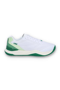 A white tennis trainer with green accents and the FILA logo on the side.