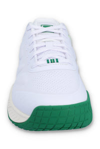A white tennis trainer with green accents and the FILA logo on the side.