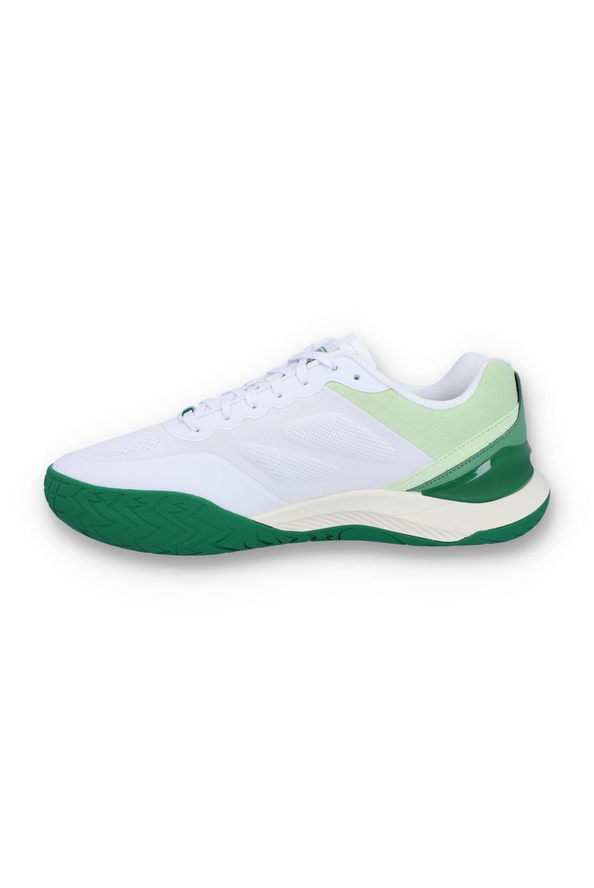 A white tennis trainer with green accents and the FILA logo on the side.