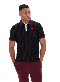 Man wearing a black pinstripe polo shirt with a FILA logo on a white background