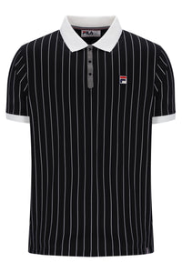 A black short-sleeve polo shirt with thin white vertical pinstripes, a white collar, and a small Fila logo patch on the left chest.