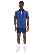 Man wearing a blue striped polo shirt and shorts on a white background