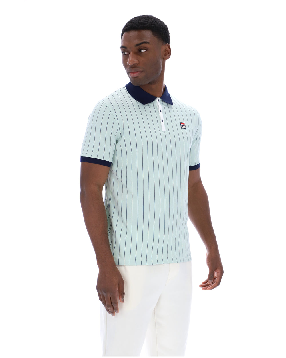 Man wearing a light blue striped polo shirt with a brand logo on a white background