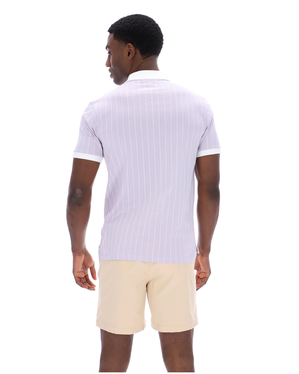Man wearing a white striped polo shirt and beige shorts on a white background