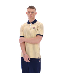 Man wearing a beige striped polo shirt with navy accents on a white background