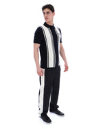 Man wearing a black and white striped outfit on a white background