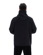 Person wearing a black hoodie from behind on a white background