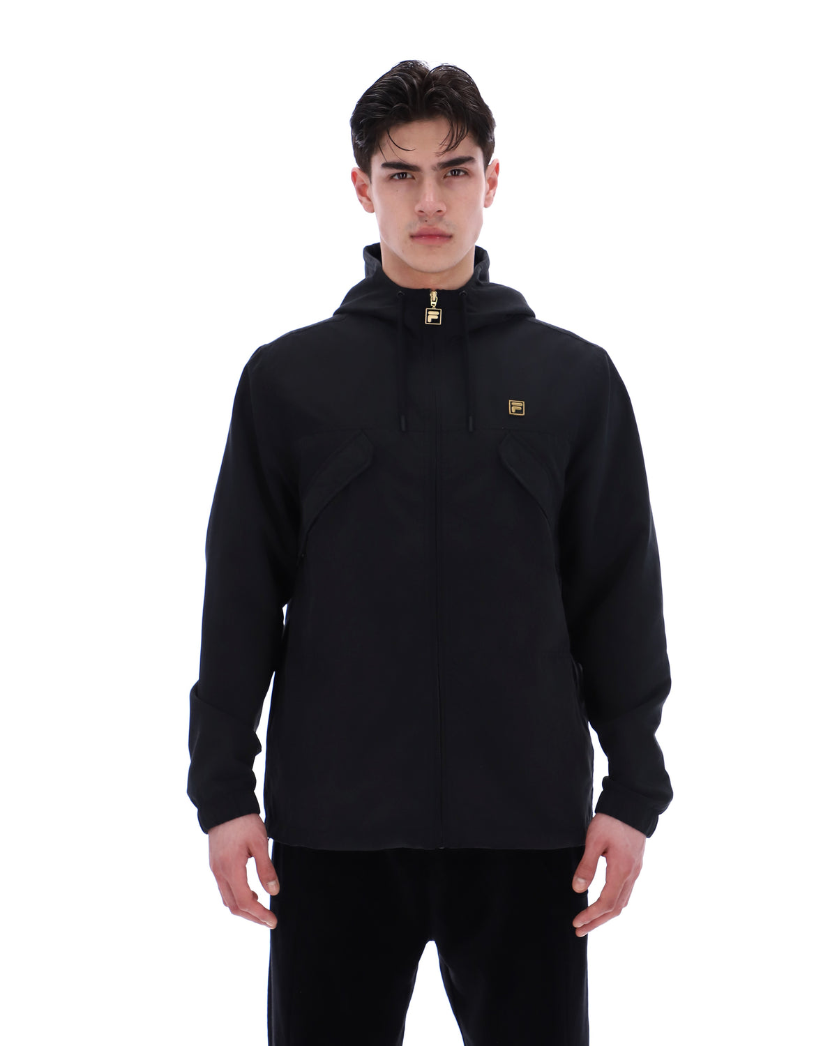 Man wearing a black pullover with a logo on a white background