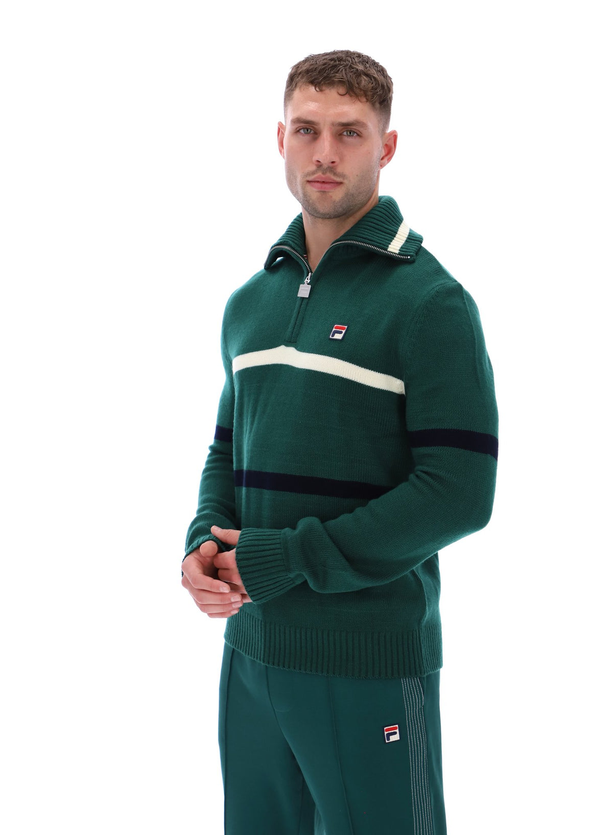 Displays a model wearing the Rain Forest 'FILA' branded Camilo Knitted Half Zip Jumper