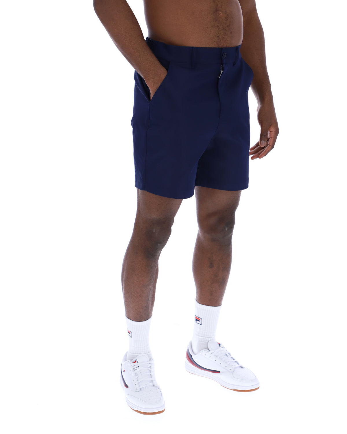 Displays a model wearing the Navy 'Fila' Caruso Chino Shorts