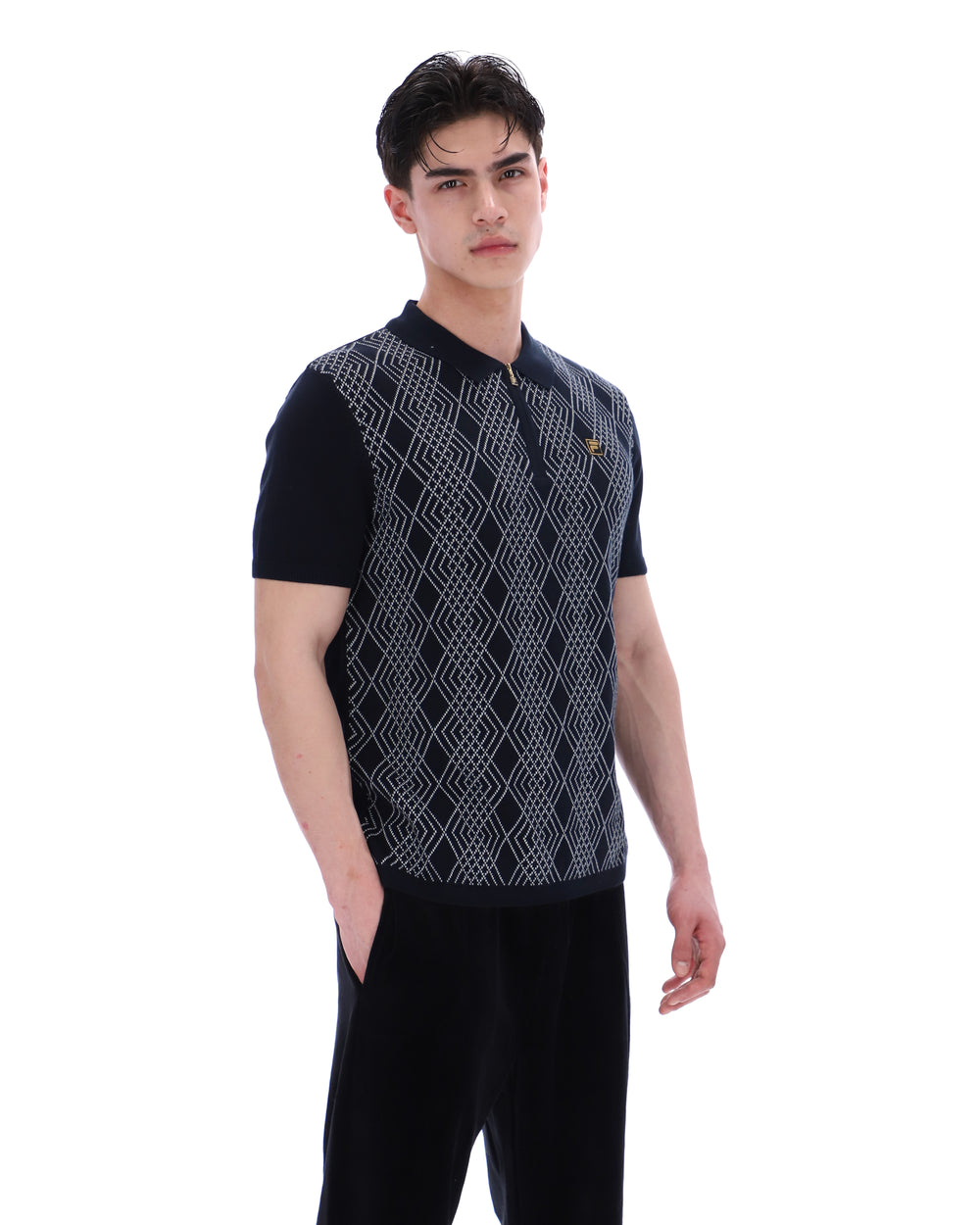 Man wearing a black and white patterned vest on a white background