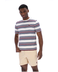 Man wearing a striped shirt and beige shorts on a white background