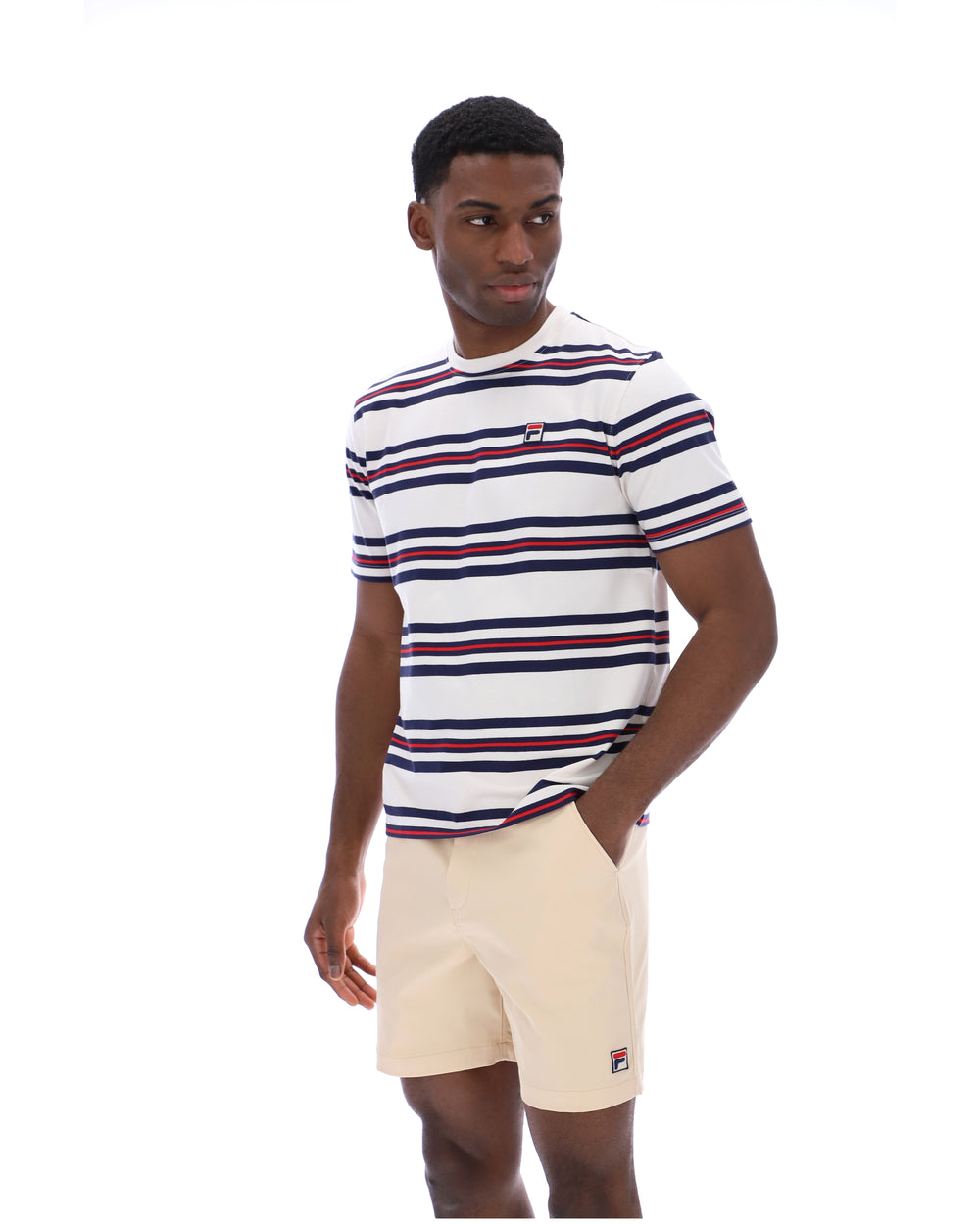 Man wearing a striped t-shirt and shorts on a white background