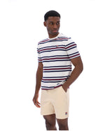 Man wearing a striped t-shirt and shorts on a white background