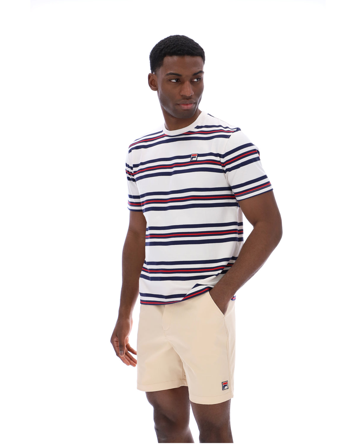 Man wearing a striped t-shirt and shorts on a white background