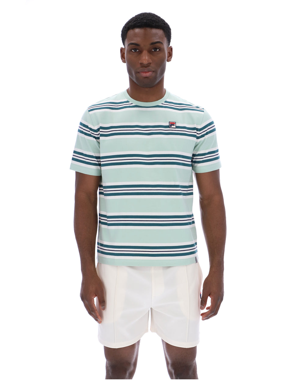 Man wearing a striped shirt and white shorts on a white background