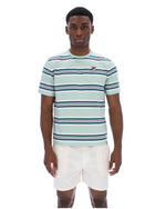 Man wearing a striped shirt and white shorts on a white background