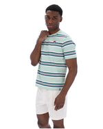 Man wearing a striped shirt and white shorts on a white background