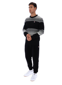 Displays a model wearing the Black 'FILA' branded Connor Striped Knit Crew Neck