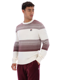 Man wearing a white and red striped sweater with FILA logo on a white background