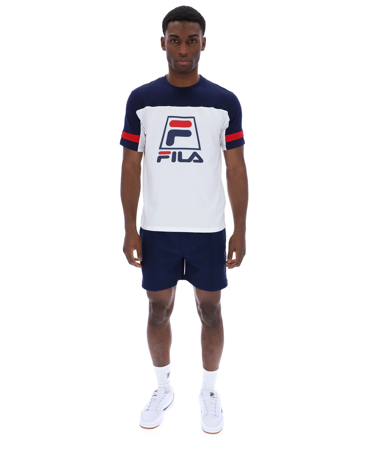 Displays a model wearing the White 'FILA' branded Damon Cut and Sew Tee