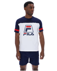 Displays a model wearing the White 'FILA' branded Damon Cut and Sew Tee