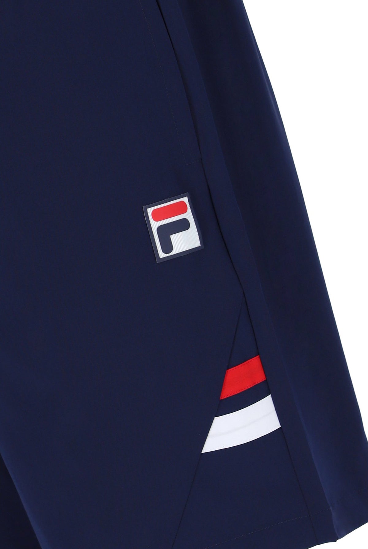 A pair of navy blue men's tennis shorts with a drawstring waist and white FILA branding on the left leg.