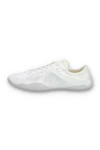 White Fila shoe on a white background.