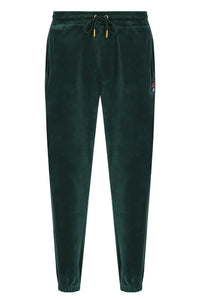Displays the Pine Needle 'FILA' branded Eddie 2 Velour Track Pant