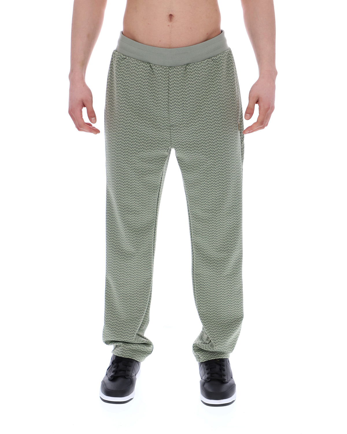 Displays a model wearing the Sea Foam 'FILA' branded Edward Herringbone Pant