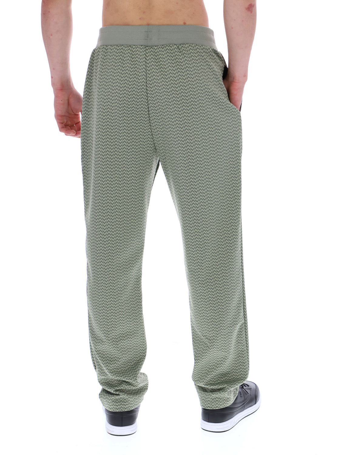 Displays a model wearing the Sea Foam 'FILA' branded Edward Herringbone Pant