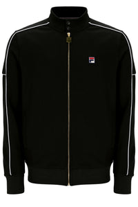A black Fila track jacket with white contrast piping along the shoulders and sleeves, featuring a gold-tone zipper and a small Fila logo patch on the left chest.