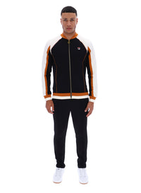 Man wearing a black and orange tracksuit with a FILA logo on a white background