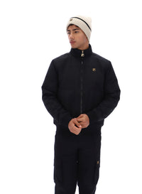 Displays a model wearing the Black 'FILA' branded Etton Bomber Jacket