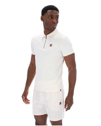 Displays a model wearing the Gardenia 'FILA' branded Ettore Zip Polo