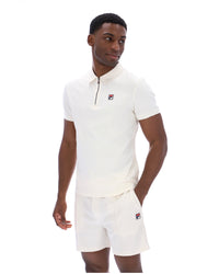 Displays a model wearing the Gardenia 'FILA' branded Ettore Zip Polo
