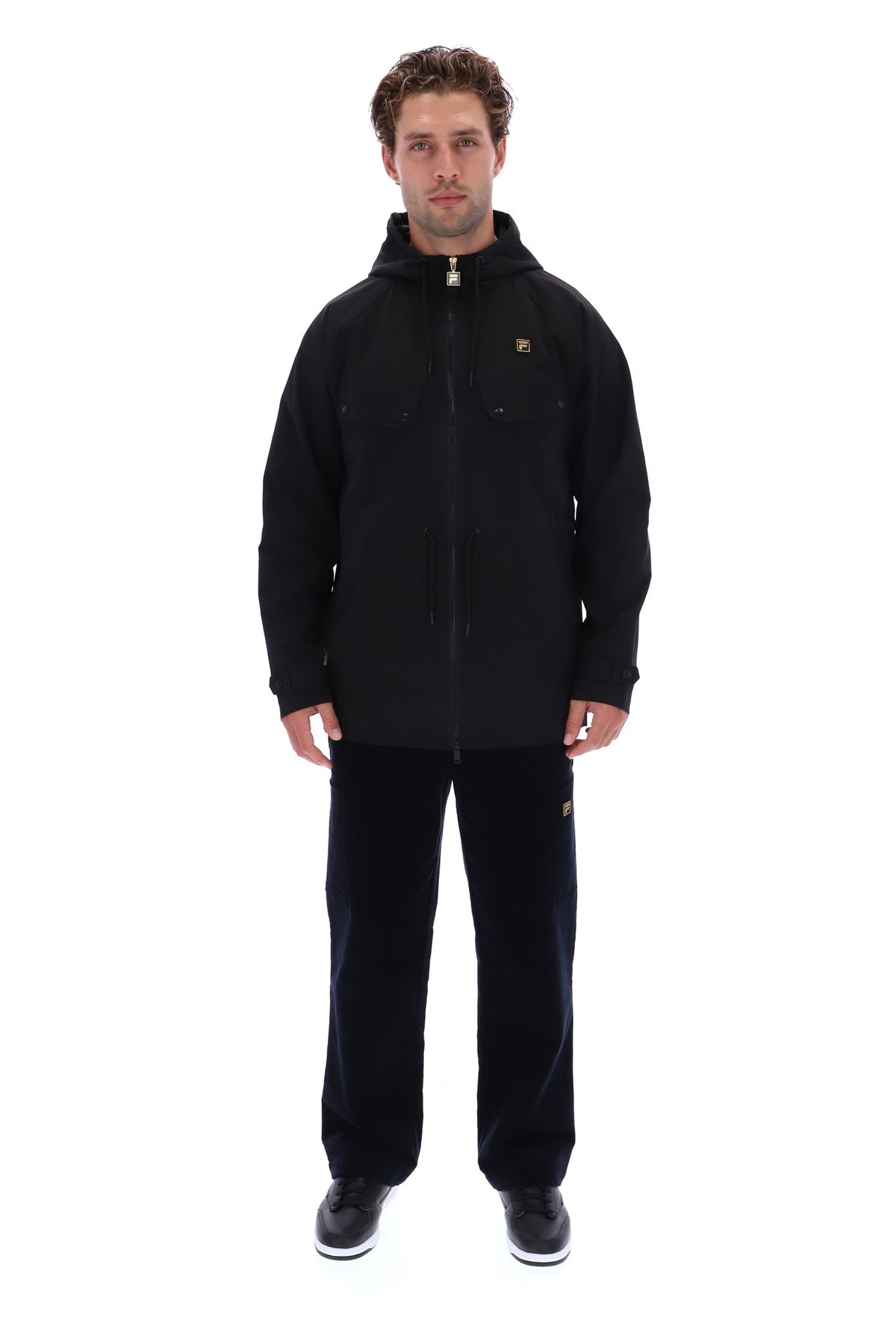 Displays a model wearing the Black 'FILA' branded Fabroni Hooded Parka