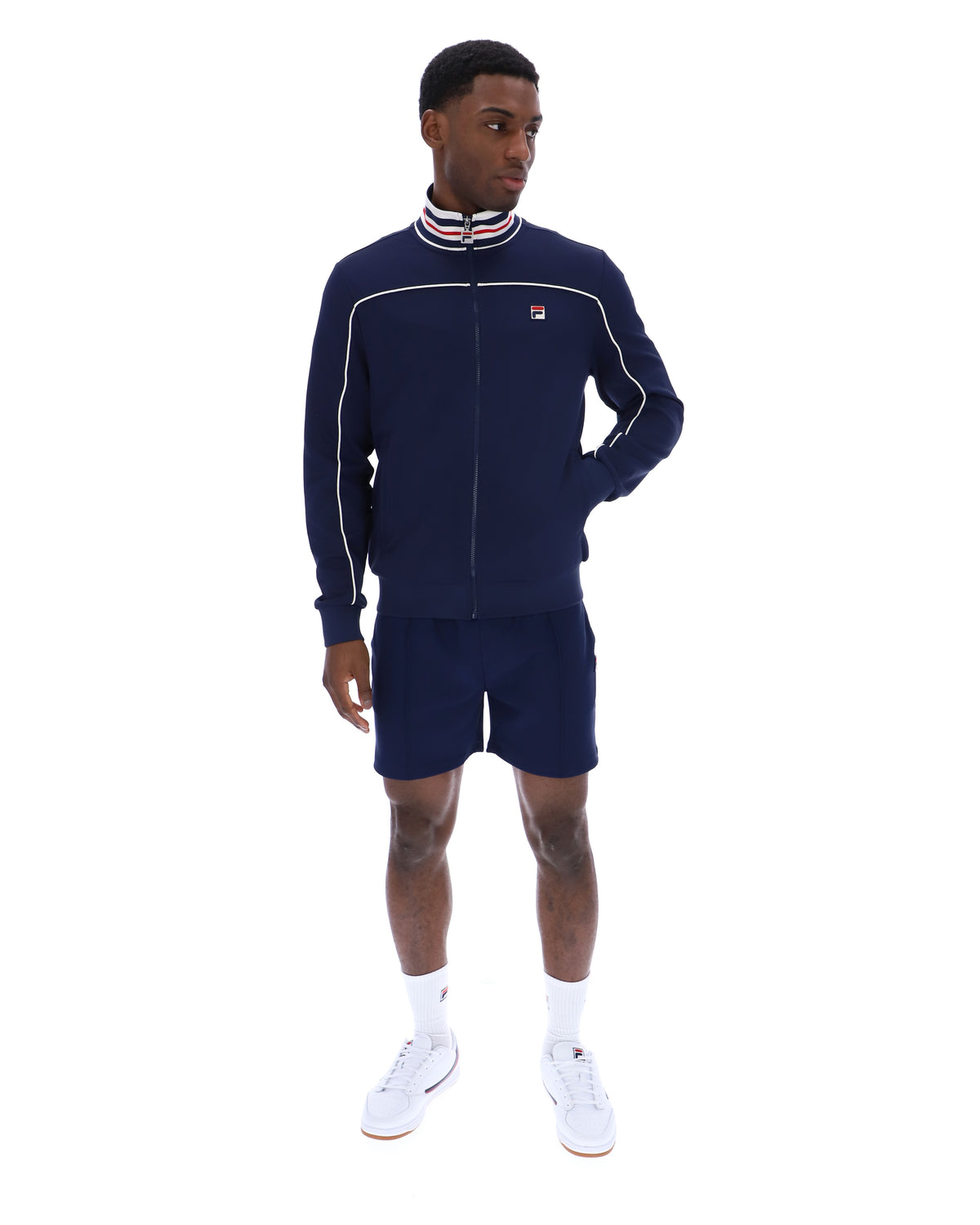 Displays a model wearing the Navy 'FILA' Federico Tipped Neck Track Top