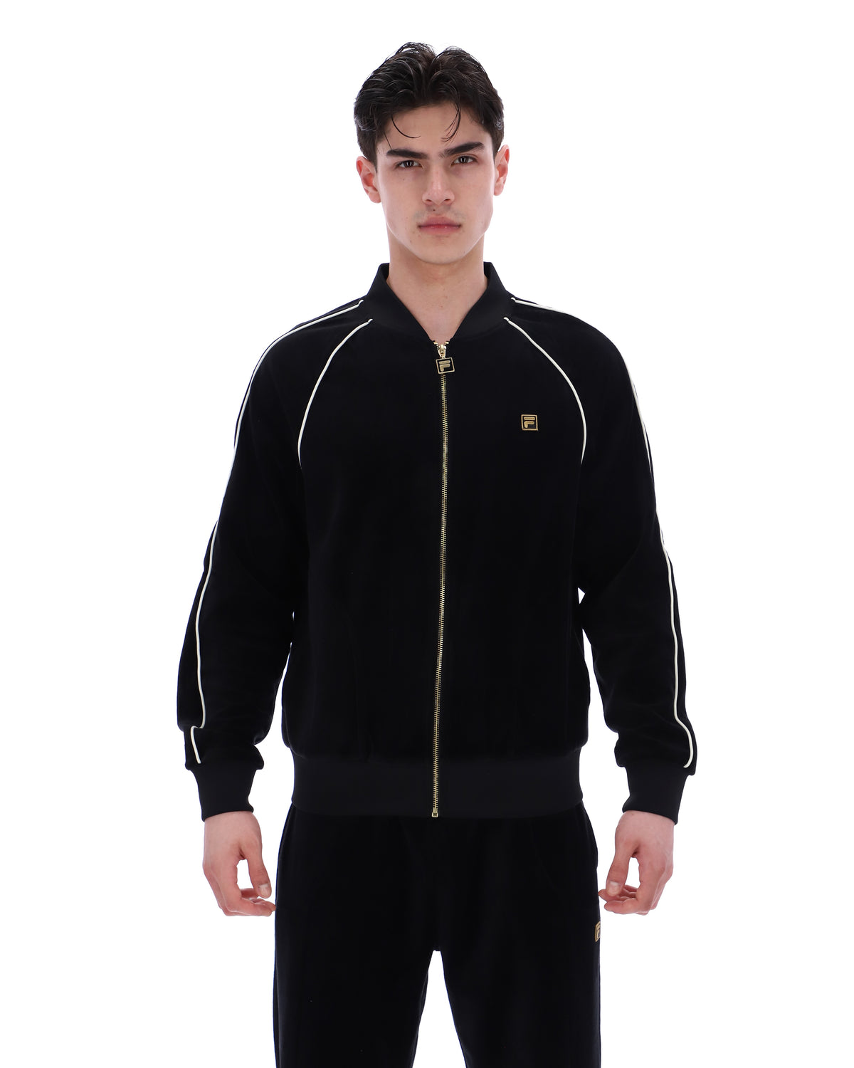 Displays a model wearing the Black 'FILA' Fella Velour Jacket