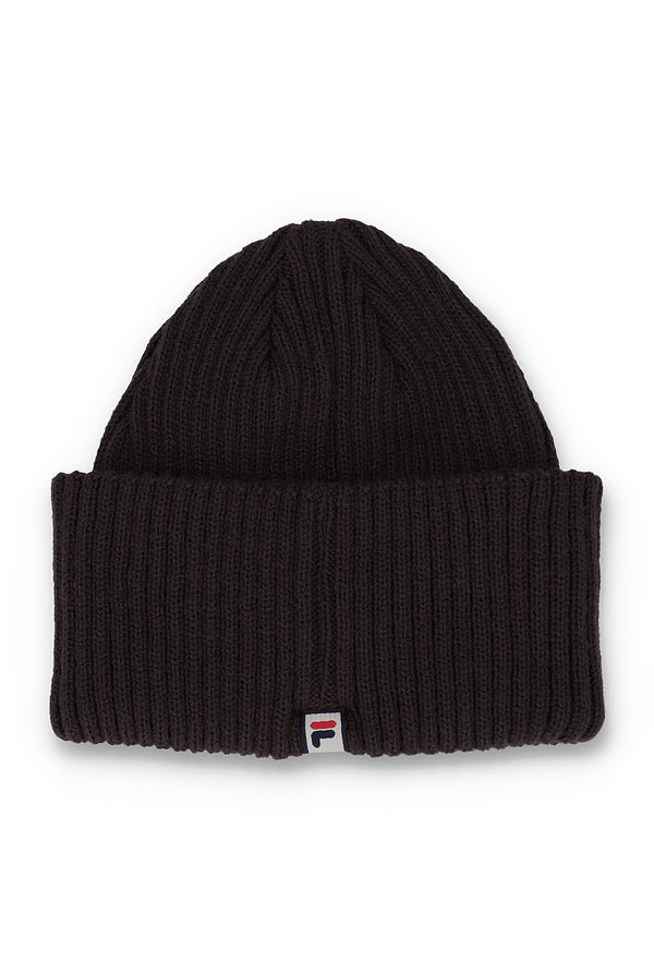 A black ribbed knit beanie hat with a small Fila logo patch on the front cuff, shown against a plain white background.