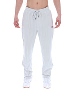 Light Grey jogger pants worn by a person on a white background