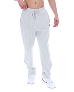 Light grey sweatpants worn by a person on a white background