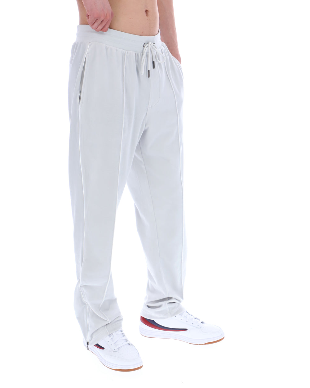 Light Grey jogger pants worn by a person on a white background