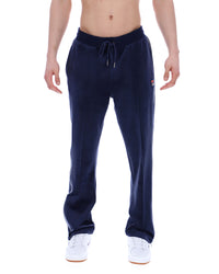 Navy blue sweatpants with a FILA logo, worn by a person on a white background