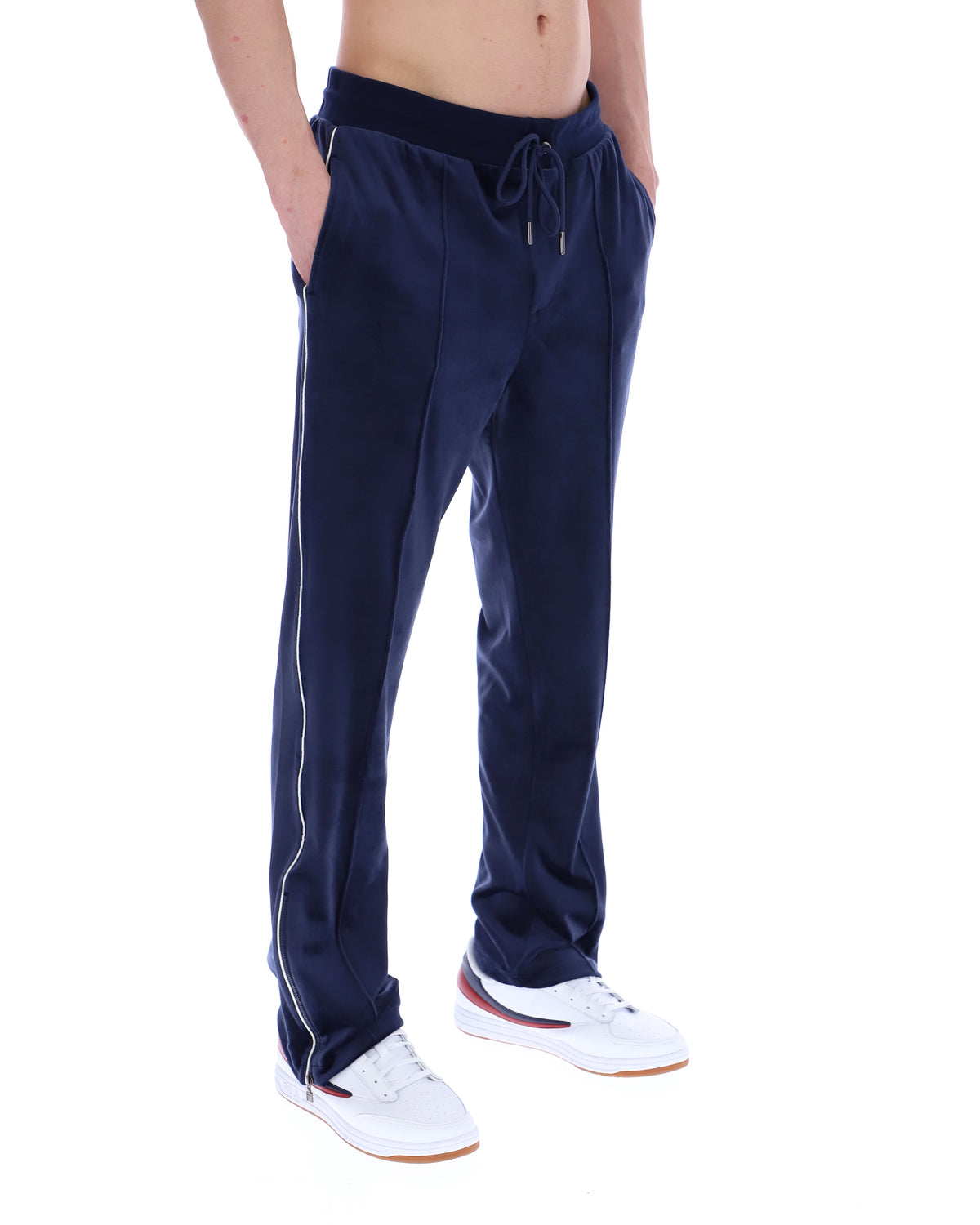 Navy blue track pants with white stripes on a white background