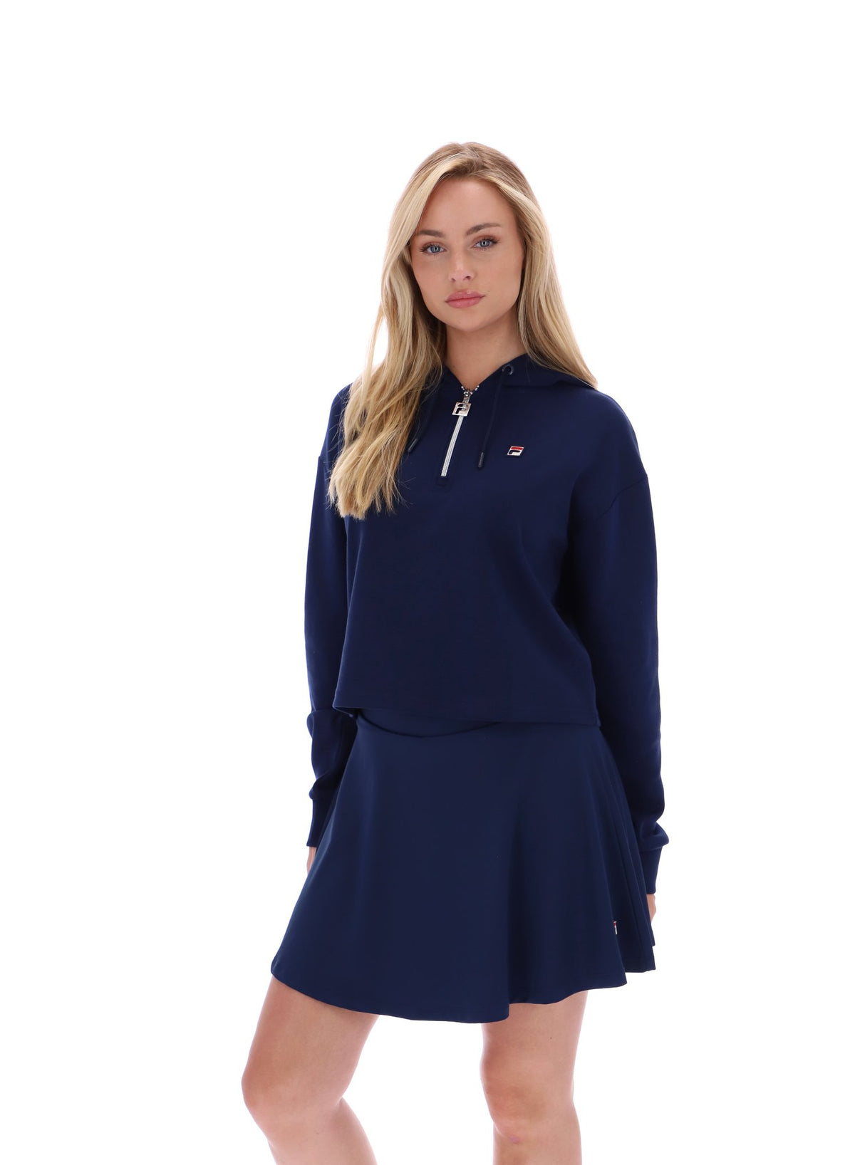 Displays a model wearing the Navy 'FILA' branded Fiorella 1/4 Zip Up Hoodie