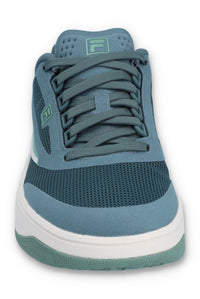 A pair of FILA FX-25 FILA TRAINER sneakers with a low-top design, primarily in green and blue colour tones, featuring the FILA logo on the side.